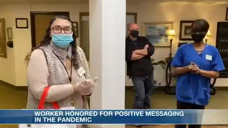 Worker honored for her positive messaging during pandemic.