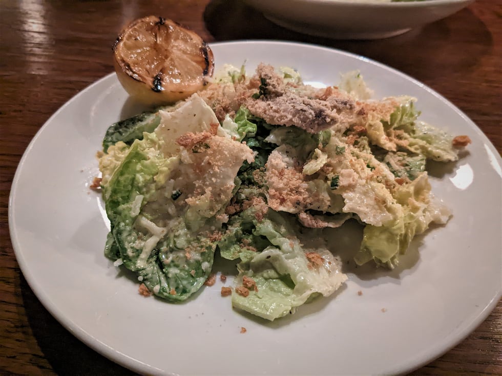 Fresh bread crumbles act as the classic crouton, with a savory dressing freshly grated...