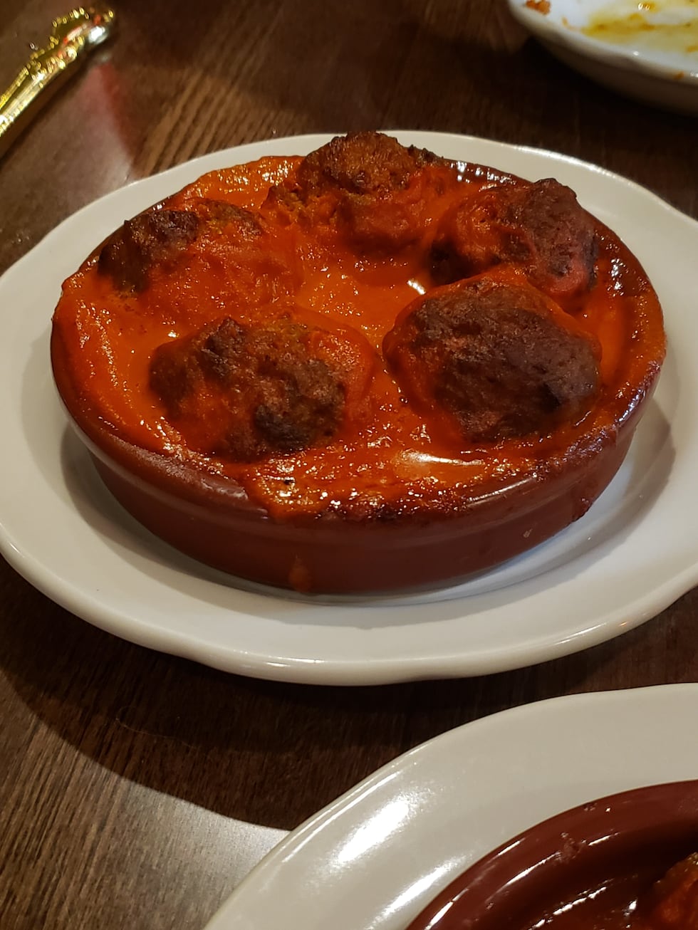 Albondigas is a traditional tapas dish featuring a beef & chorizo meatball smothered in savory...