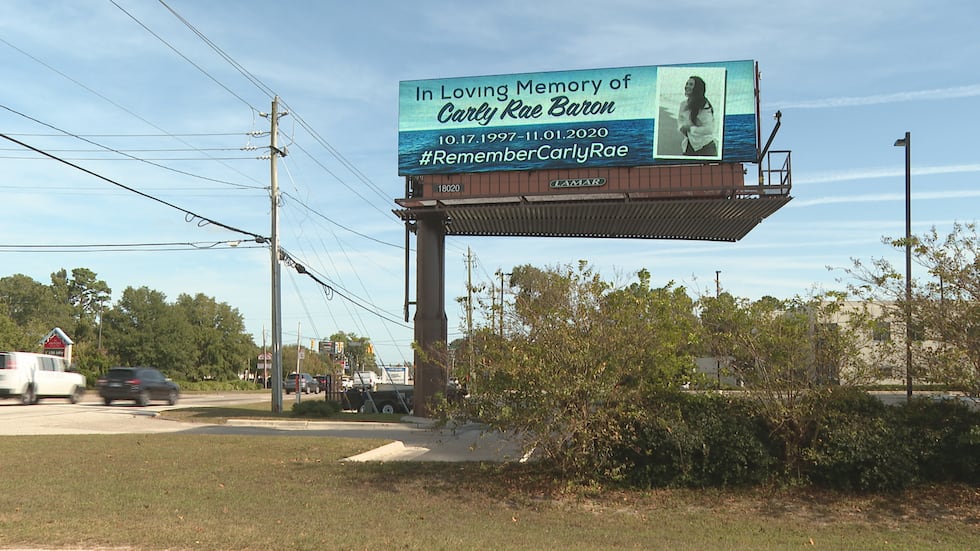 Carly Baron billboard near Trader Joes on College Road and Oleander Drive.