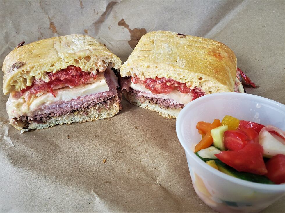 A hybrid Italian and Cuban sandwich, a fresh loaf of Ciabatta bread creates the perfect...