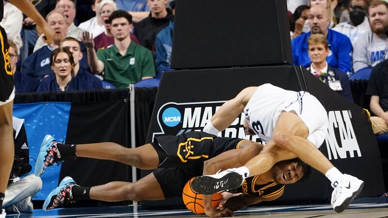 Kennesaw guard Terrell Burden (1) and Xavier guard Colby Jones (3) battle for the ball during...