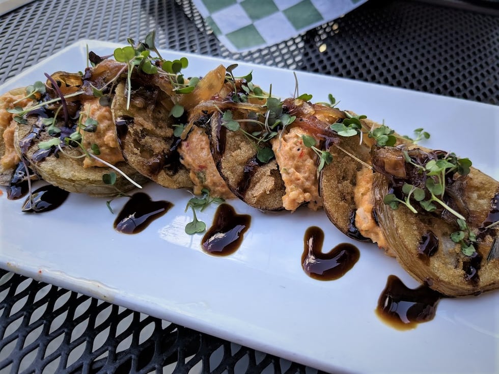 Lightly fried, these green tomatoes were covered in a lovely onion jam, spicy pimento cheese,...