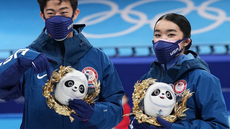 Silver medalists Karen Chen and Nathan Chen pose for a photo after the team event in the...