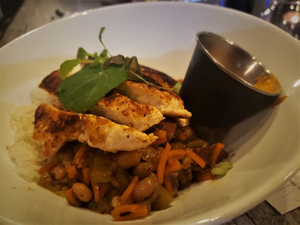 Blackened chicken breast, over a wonderful base of hoppin' John that eats more of like a...