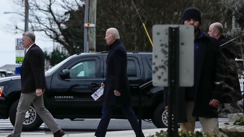 President Joe Biden walks from St. Edmund Roman Catholic Church after attending Mass in...