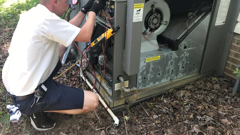 Morris-Jenkins Technician working on a AC unit