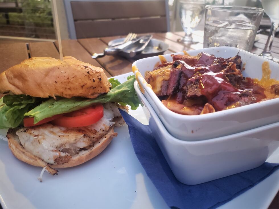 A perfectly grilled mahi mahi (varies with catch of the day) sandwich with a side of the Texas...