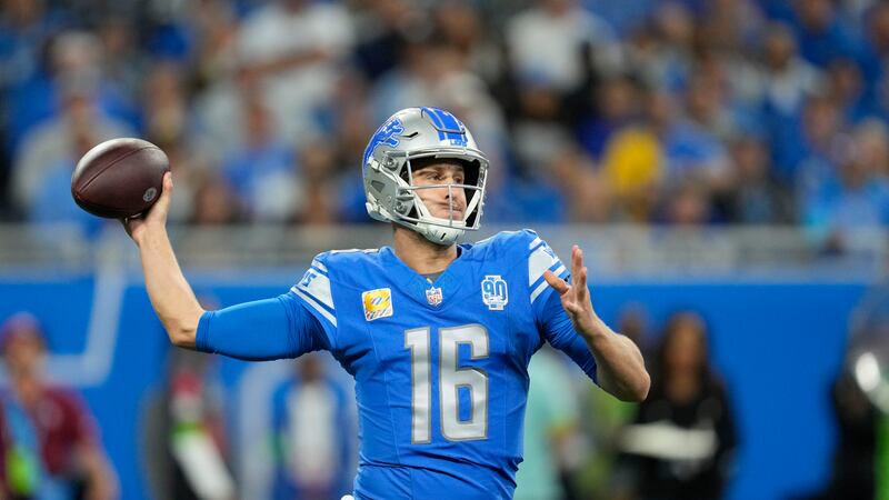 Detroit Lions quarterback Jared Goff (16) passes in the first half of an NFL football game...