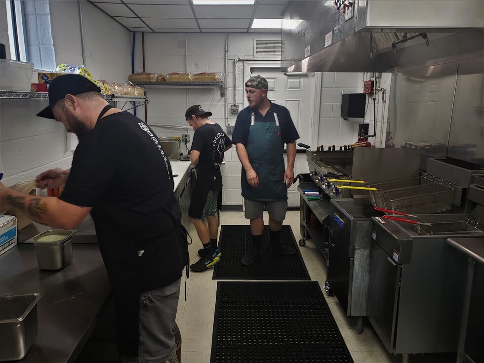 CheeseSmith's dedicated crew preps for a busy day at the new brick-and-mortar restaurant.