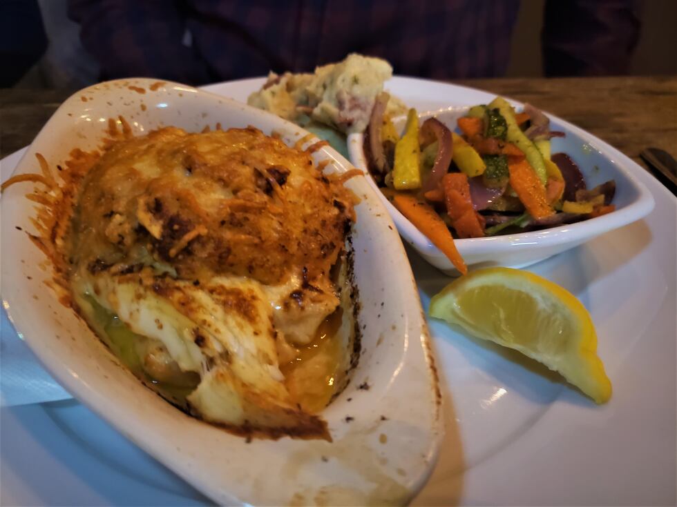 A nice piece of flounder that's stuffed with various seafood, topped with cheese and a rich...