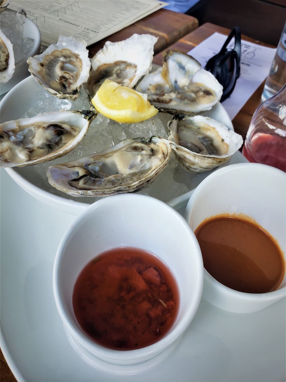 Fresh oysters, with house made hot sauce and mignonette, a perfect coastal appetizer as you...