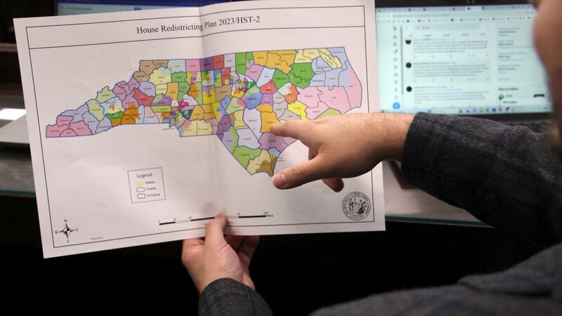The North Carolina state House reviews copies of a map proposal for new state House districts...