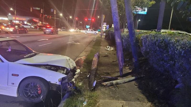 Car hits power poles on S. College Road.