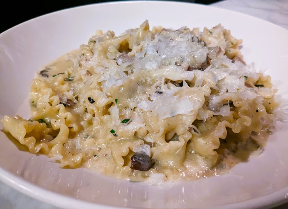 Long pieces of mafaldine pasta are tossed in a cream sauce, complete with crabs from North...
