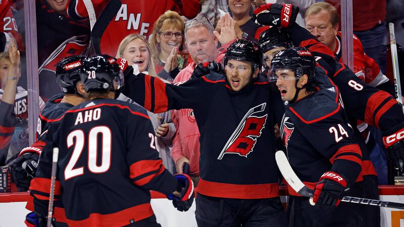 Carolina Hurricanes' Michael Bunting, center, celebrates his goal against the Ottawa Senators...