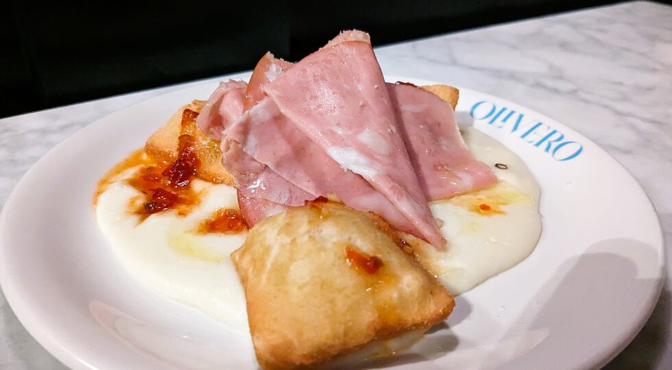 A fresh take on the New Orleans' classic, these beignets rest on a pool of fontina fonduta,...