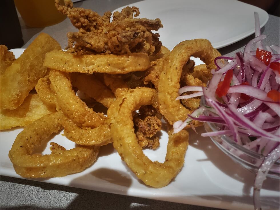 Fresh and cripsy, this calamari is excellent...but beware of the onion relish, you'll want to...